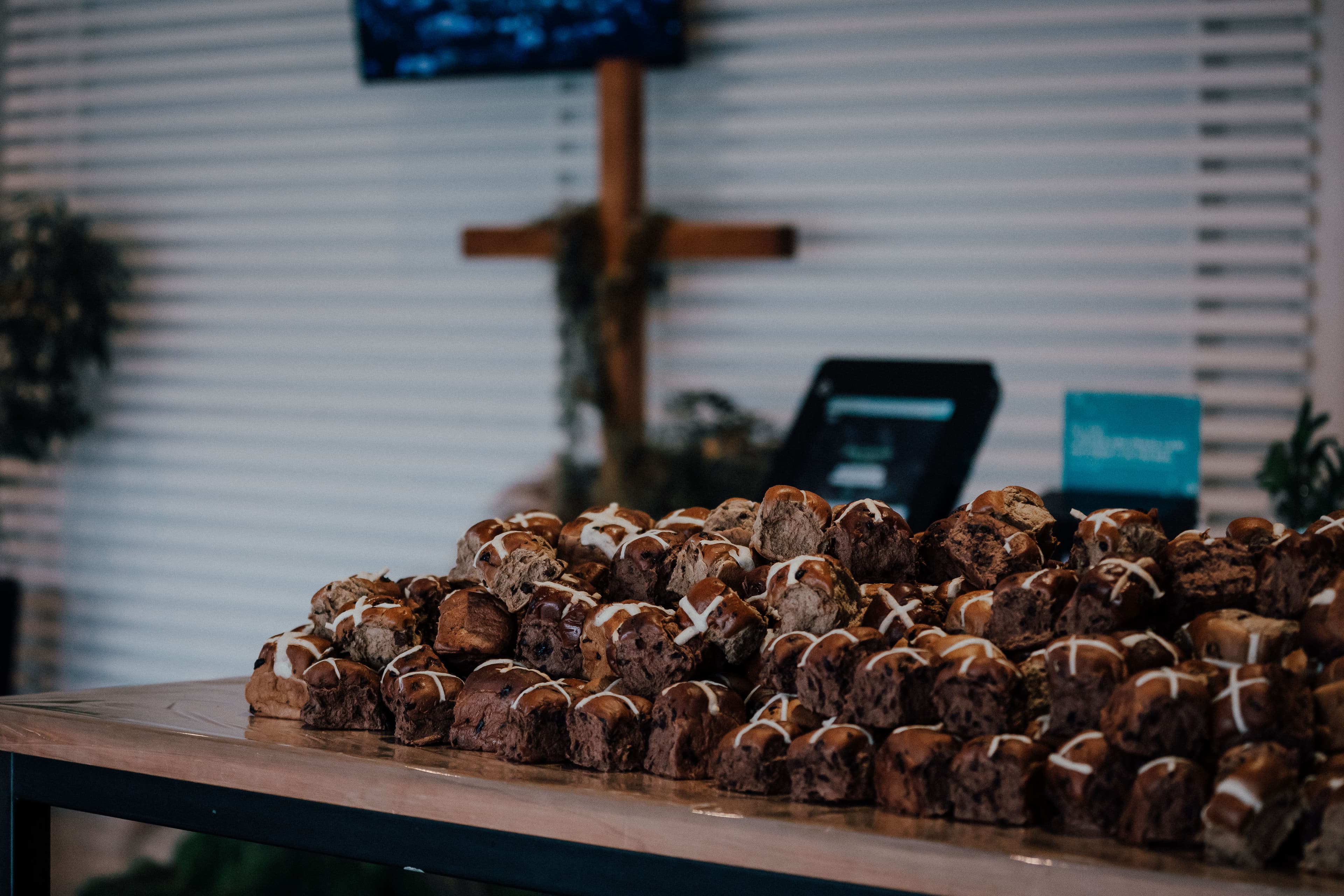 Hot cross buns on a table for people after an Easter service