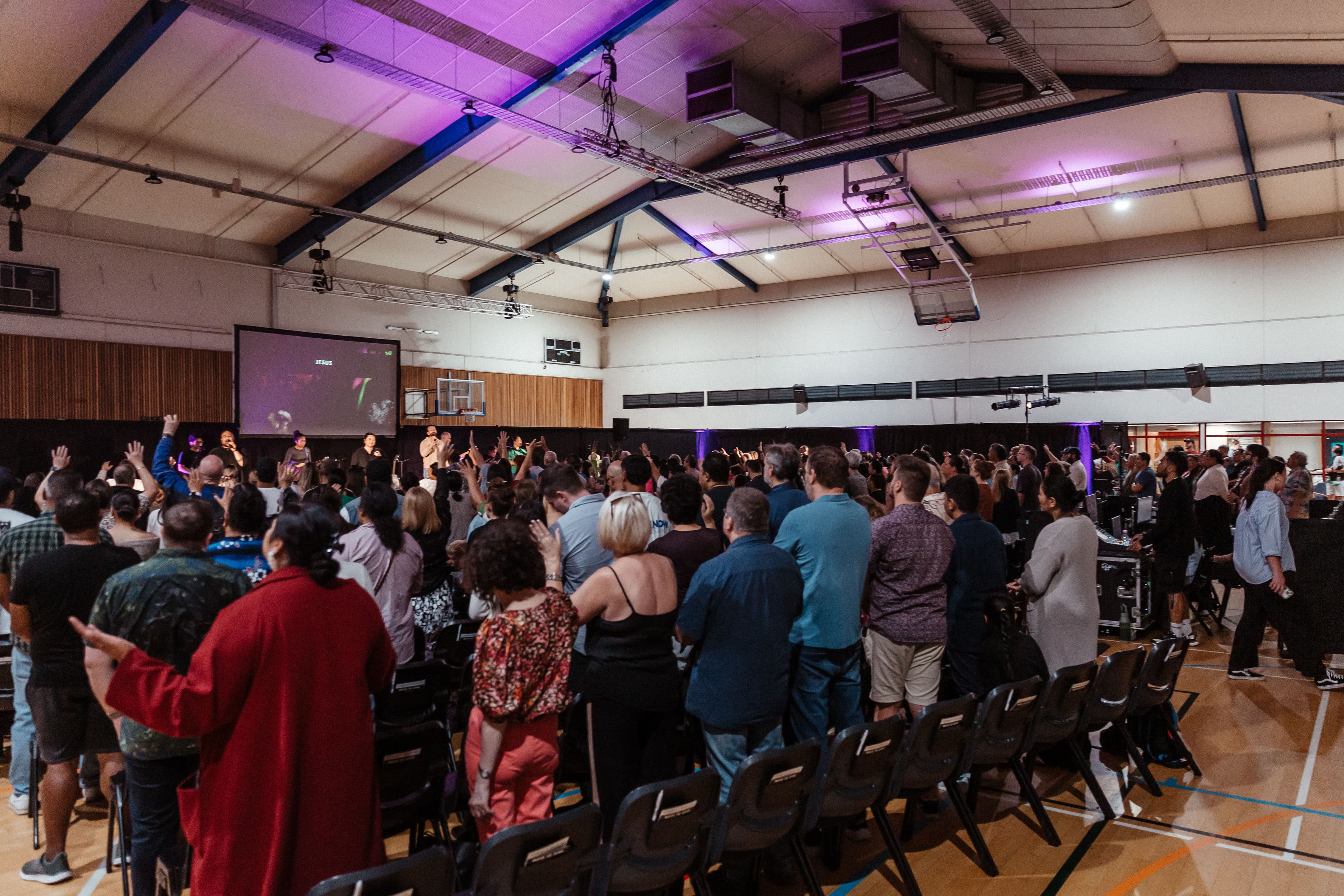 West congregation from back left of room during worship