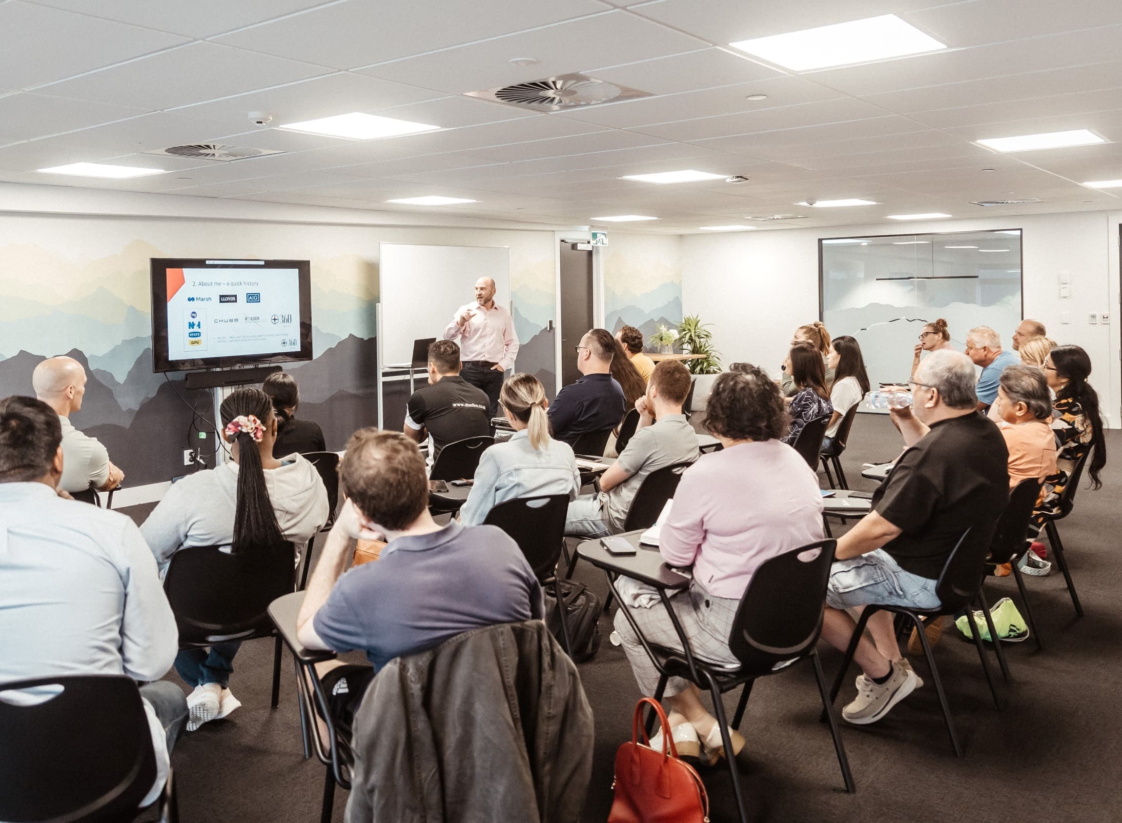 People sitting listening to a course presenter at Night School