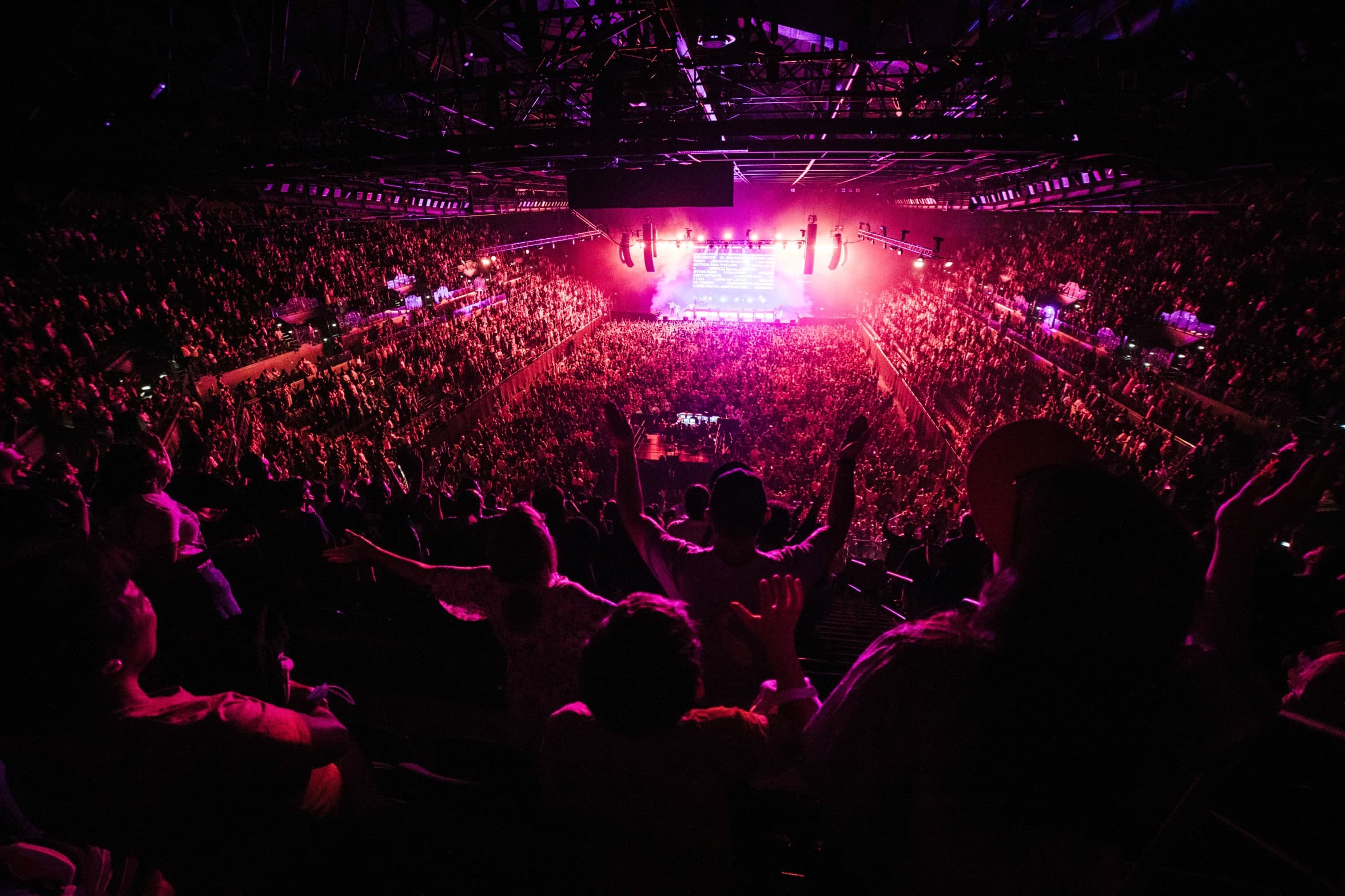Wide shot from the very back of Open Heaven at Spark Arena with pink wash due to the lighting