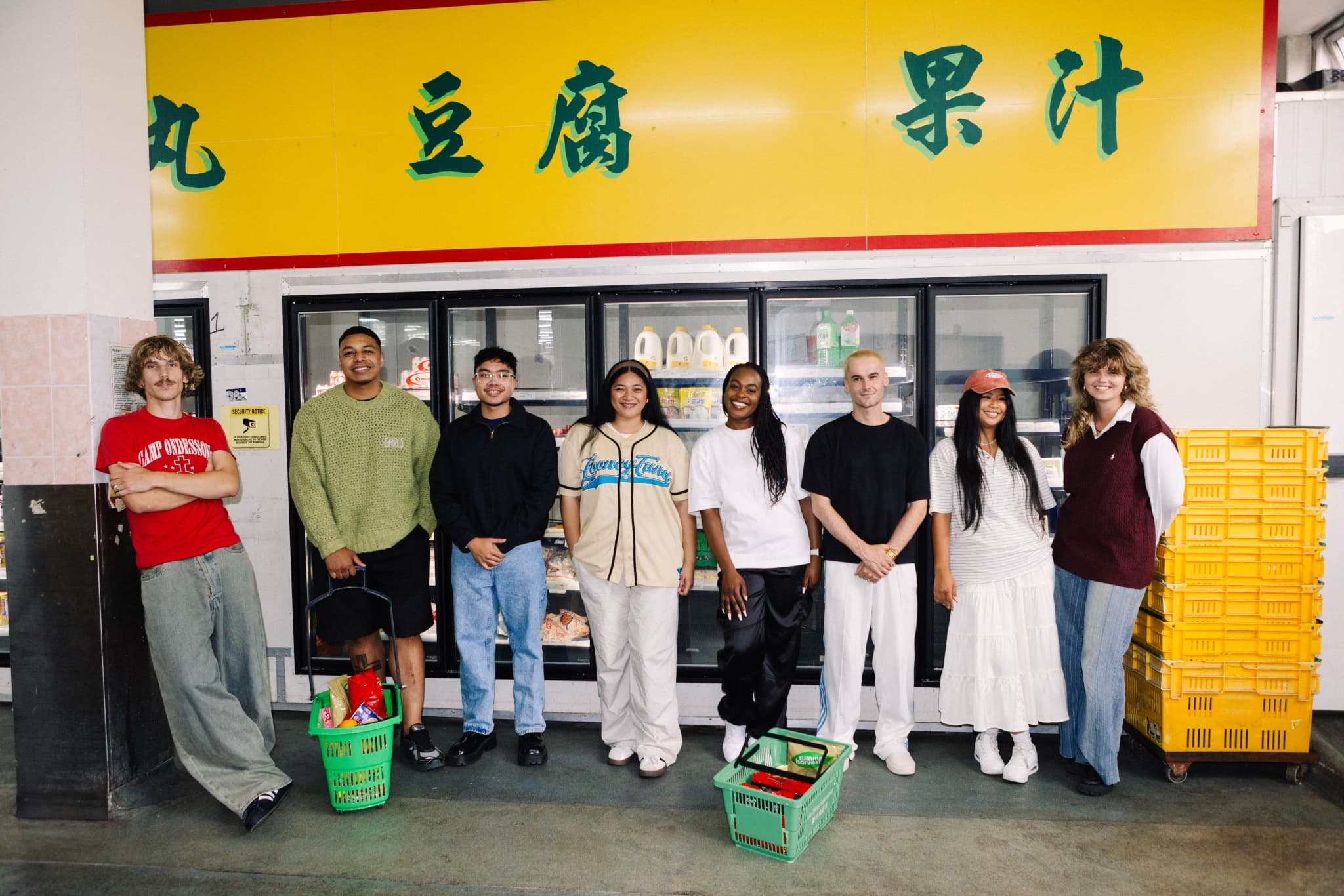 Young Adults posing in front of an asian grocer
