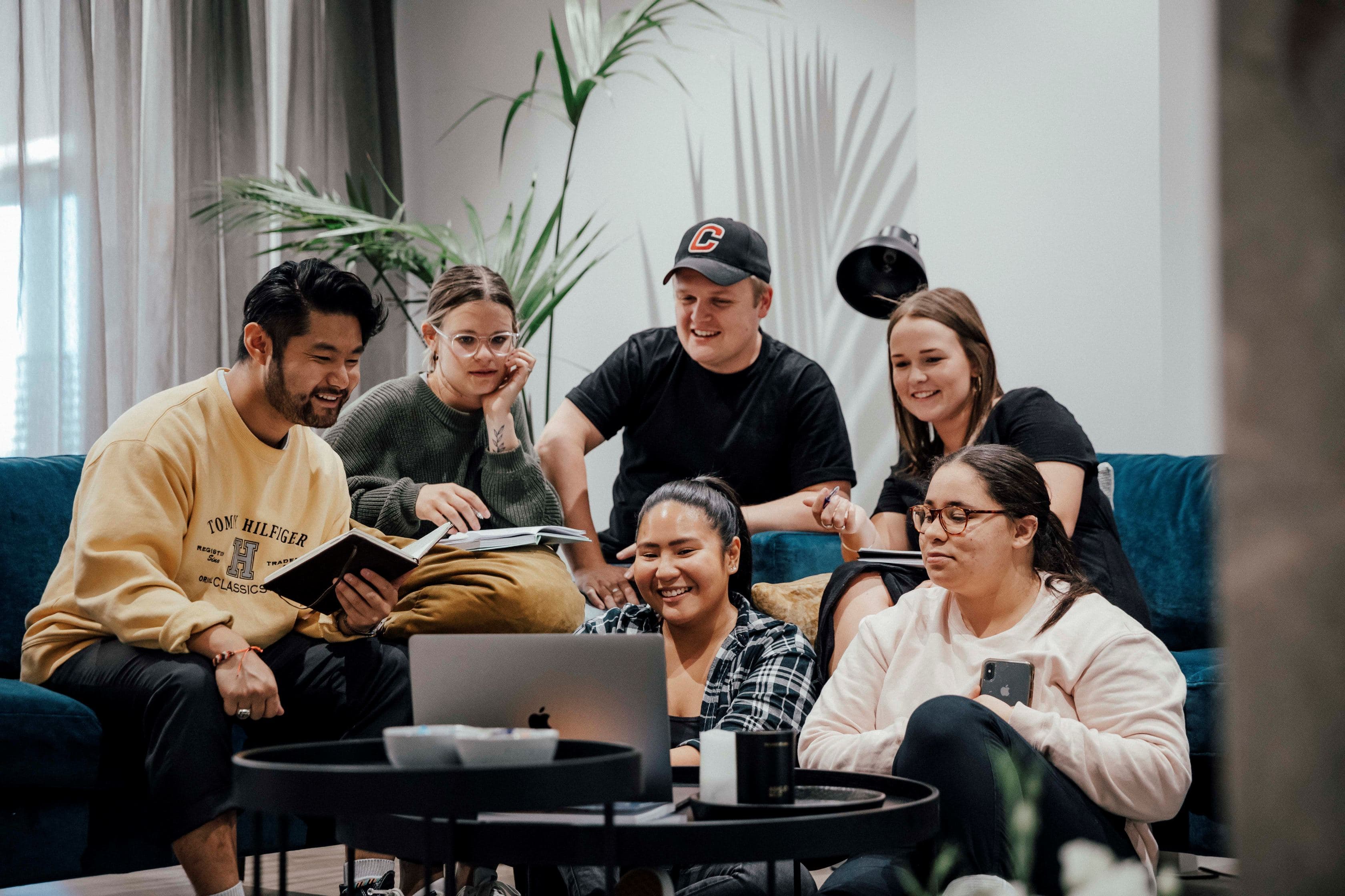 A group watching a video on a laptop