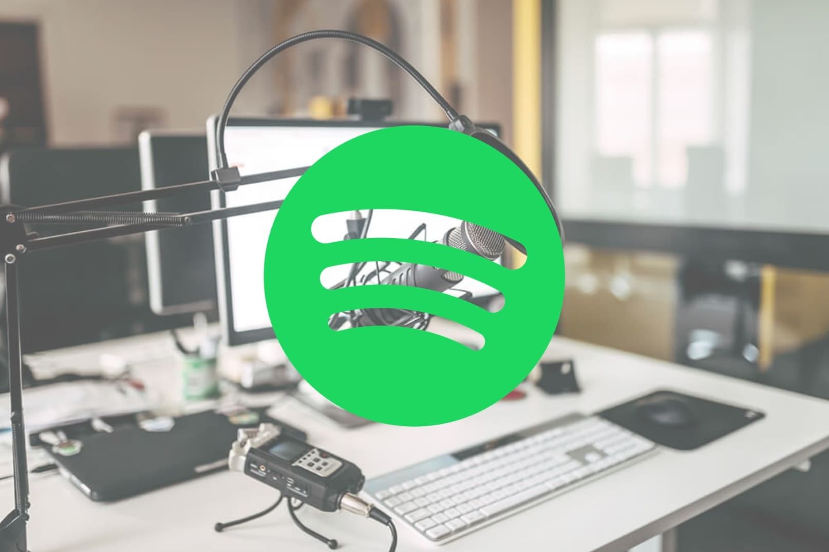 Podcast station set up with green Spotify logo overlaid